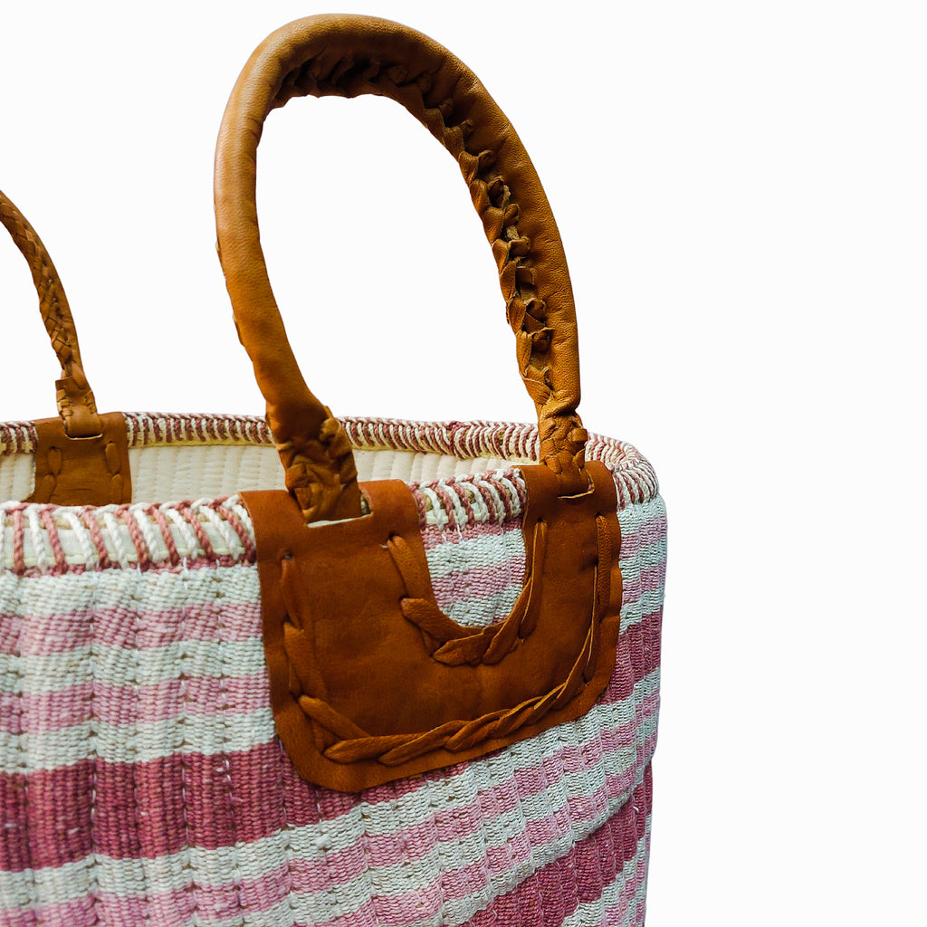 a Gulabi Striped Pink Cotton & Jute Handloom basket with leather handles.