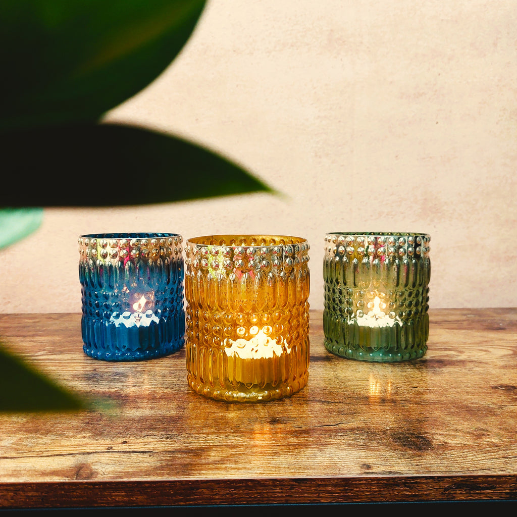 Anav handmade glass tumbler shaped tealight candle holders with bubble pattern and silver finish on the rim in yellow, blue and green colour options 