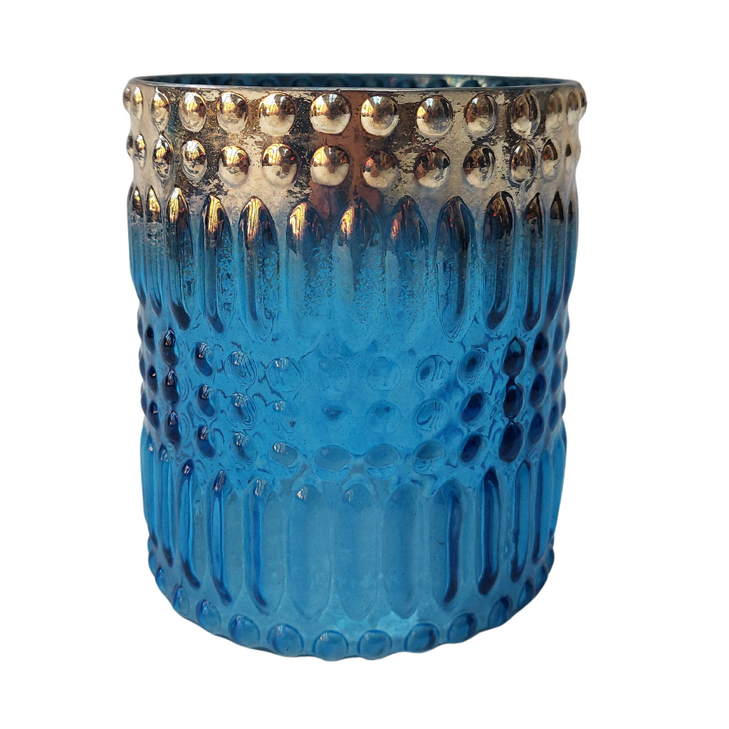 Anav Handmade glass tumbler shaped blue tealight candle holder with bubble pattern and silver finish on the rim in a white background 